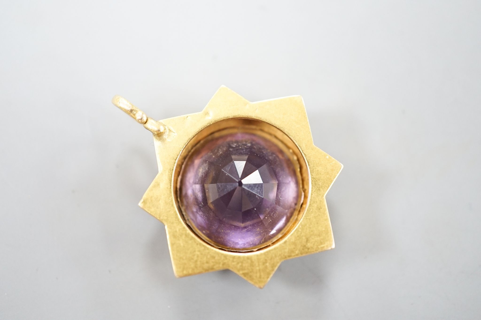 A late Victorian yellow metal and amethyst set pendant, 35mm, gross 7.5 grams.